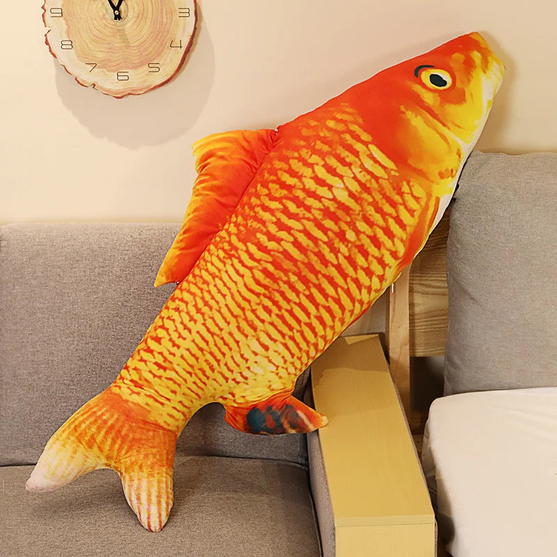The red carp pillow on its own - deep orange printed scales and a fanned tail