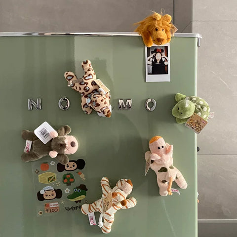 Plush Lion Fridge Magnet shown on a refrigerator