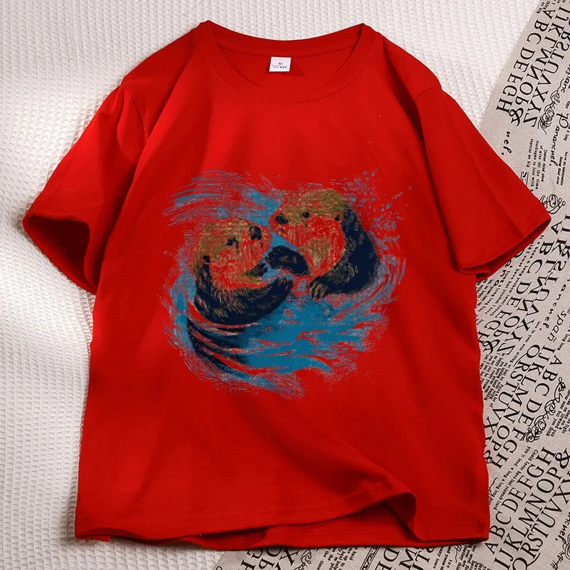 Red sea otter tee laid flat, two otters printed on the chest