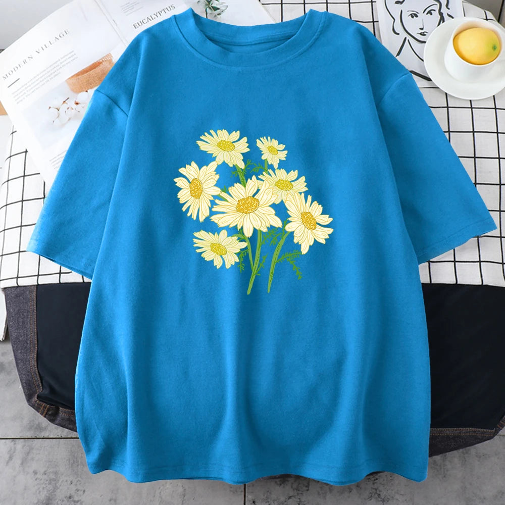 Light blue short-sleeve cotton t-shirt printed with a bouquet of yellow and cream daisy-like chrysanthemums
