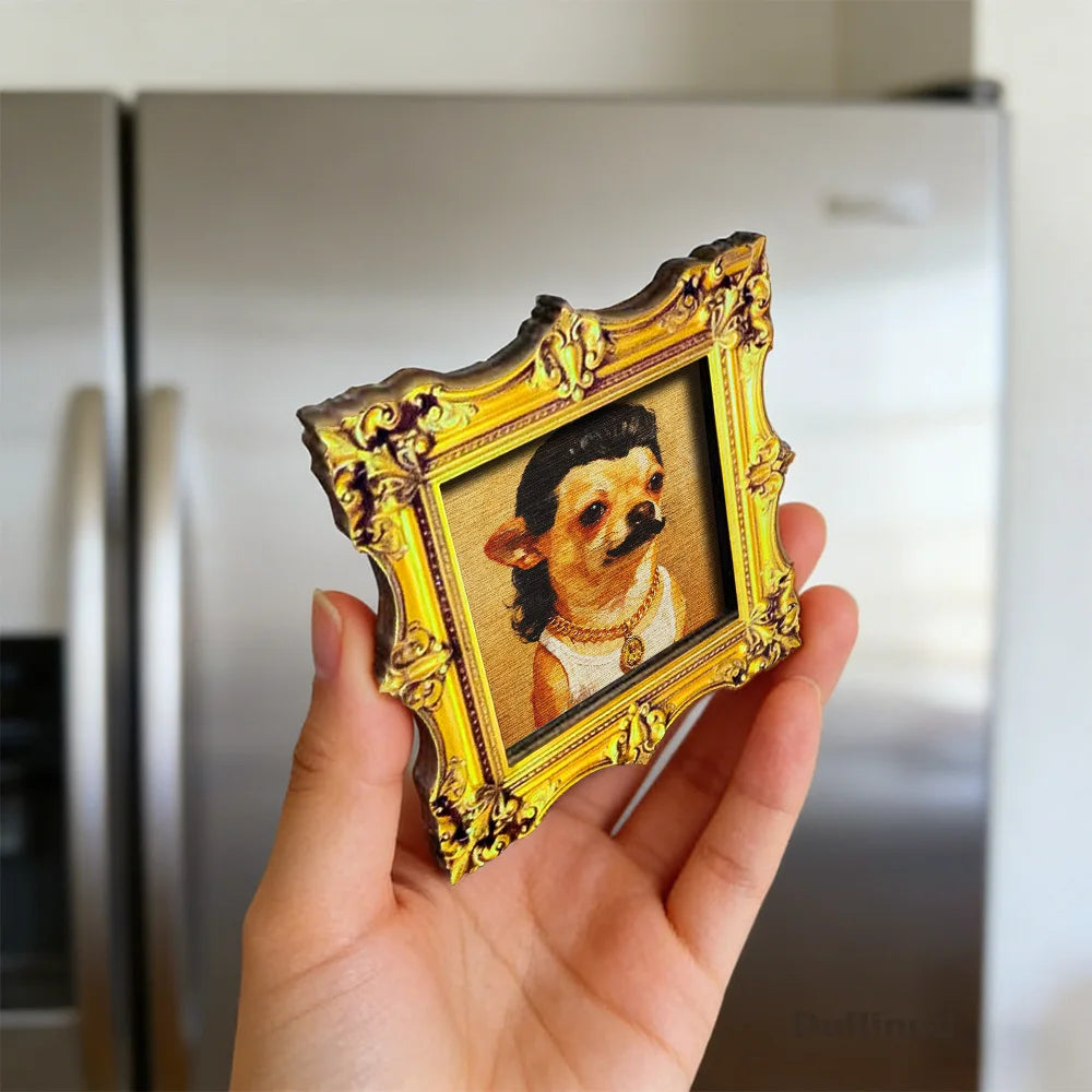 The framed magnet held in a hand in front of a fridge to show the scale