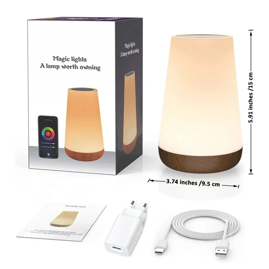 The lamp beside its retail box, measured at 15 cm tall and 9.5 cm wide, with the manual, round-pin plug adapter and USB-C cable