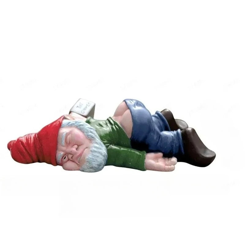 Medium Green, the green-shirted gnome lying face down on a plain background