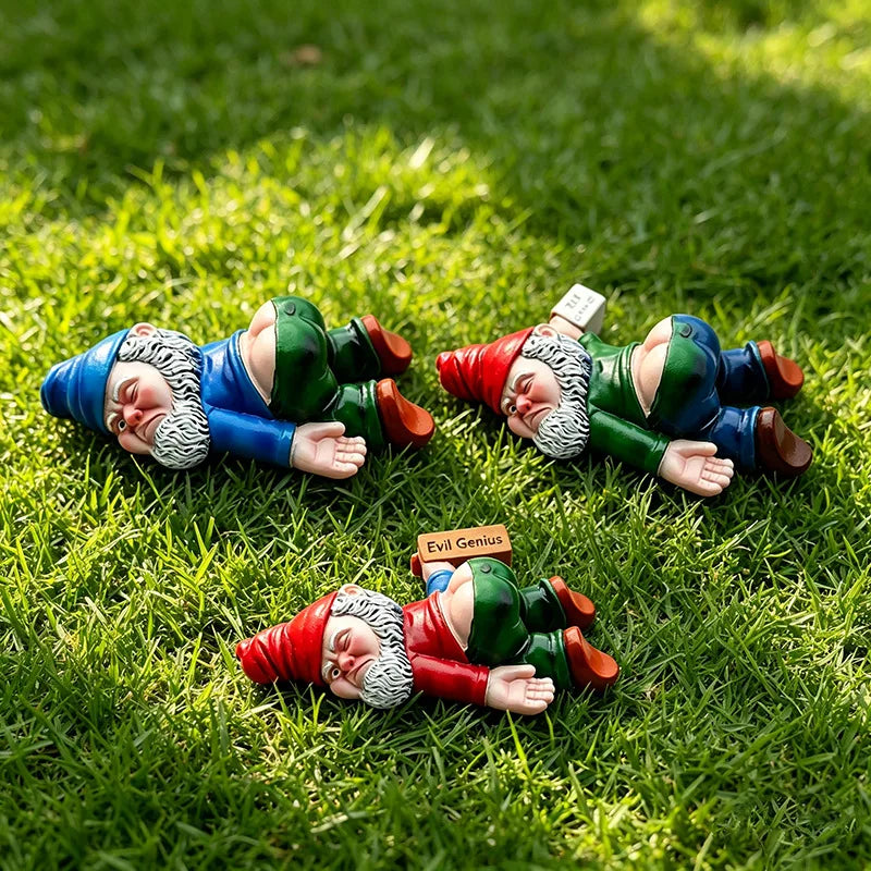 The random-colour option: three gnomes in different outfits lying in grass