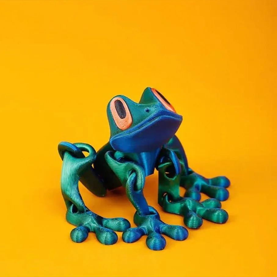 The blue-green frog sitting upright against an orange background