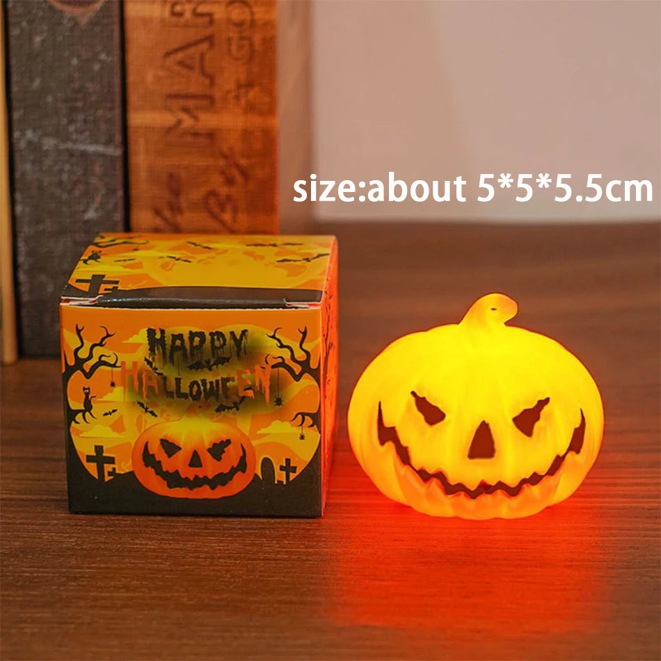 Small Single: one lit pumpkin lantern beside its box, about 5 x 5 x 5.5 cm
