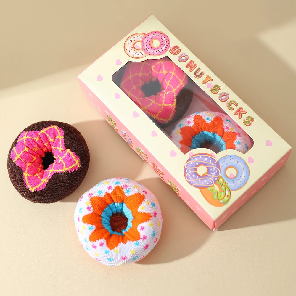 The two donut socks beside their printed window gift box