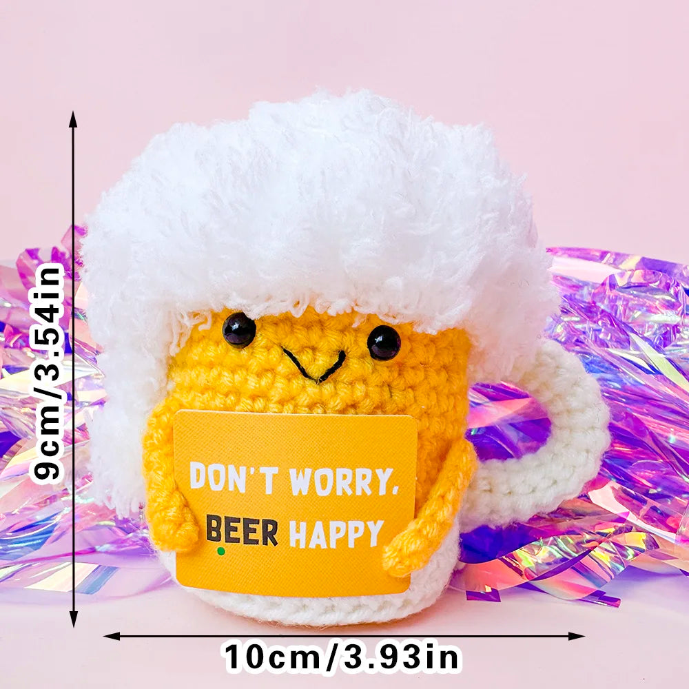 Crochet positive affirmation doll holding an encouragement card
