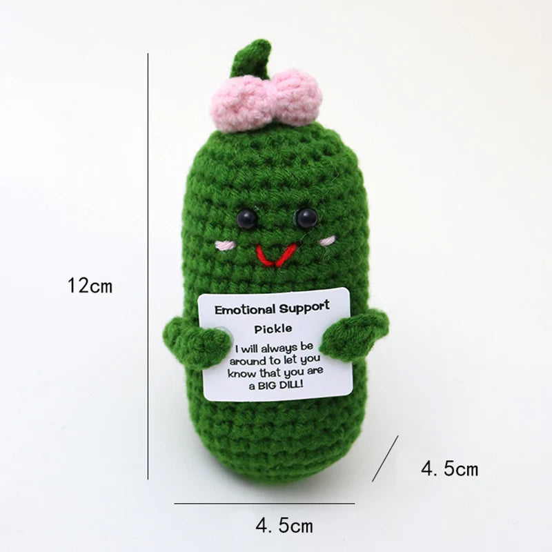 Crochet positive affirmation doll holding an encouragement card