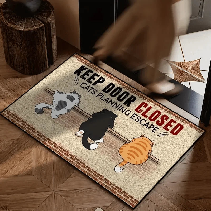 The brick wall three cat doormat on a herringbone wood floor as someone steps onto it