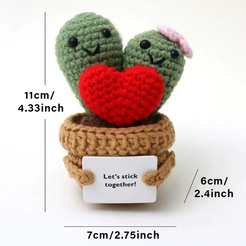 Crochet positive affirmation doll holding an encouragement card