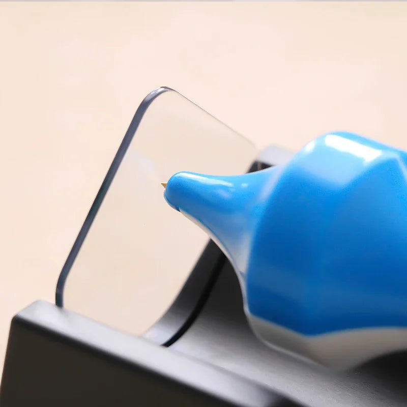 Close-up of the top's tip resting against the clear upright plate
