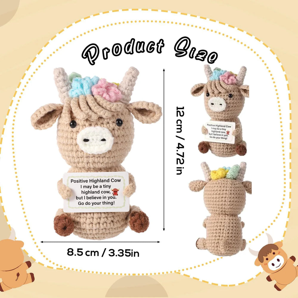 Crochet positive affirmation doll holding an encouragement card