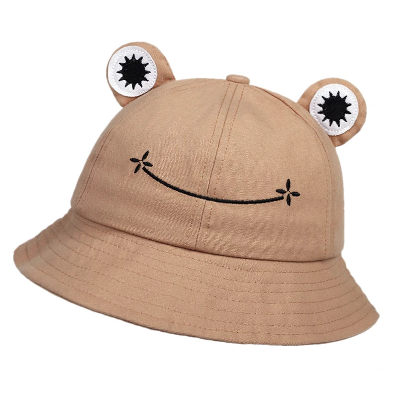 Khaki cotton bucket hat with applique frog eyes and an embroidered smile