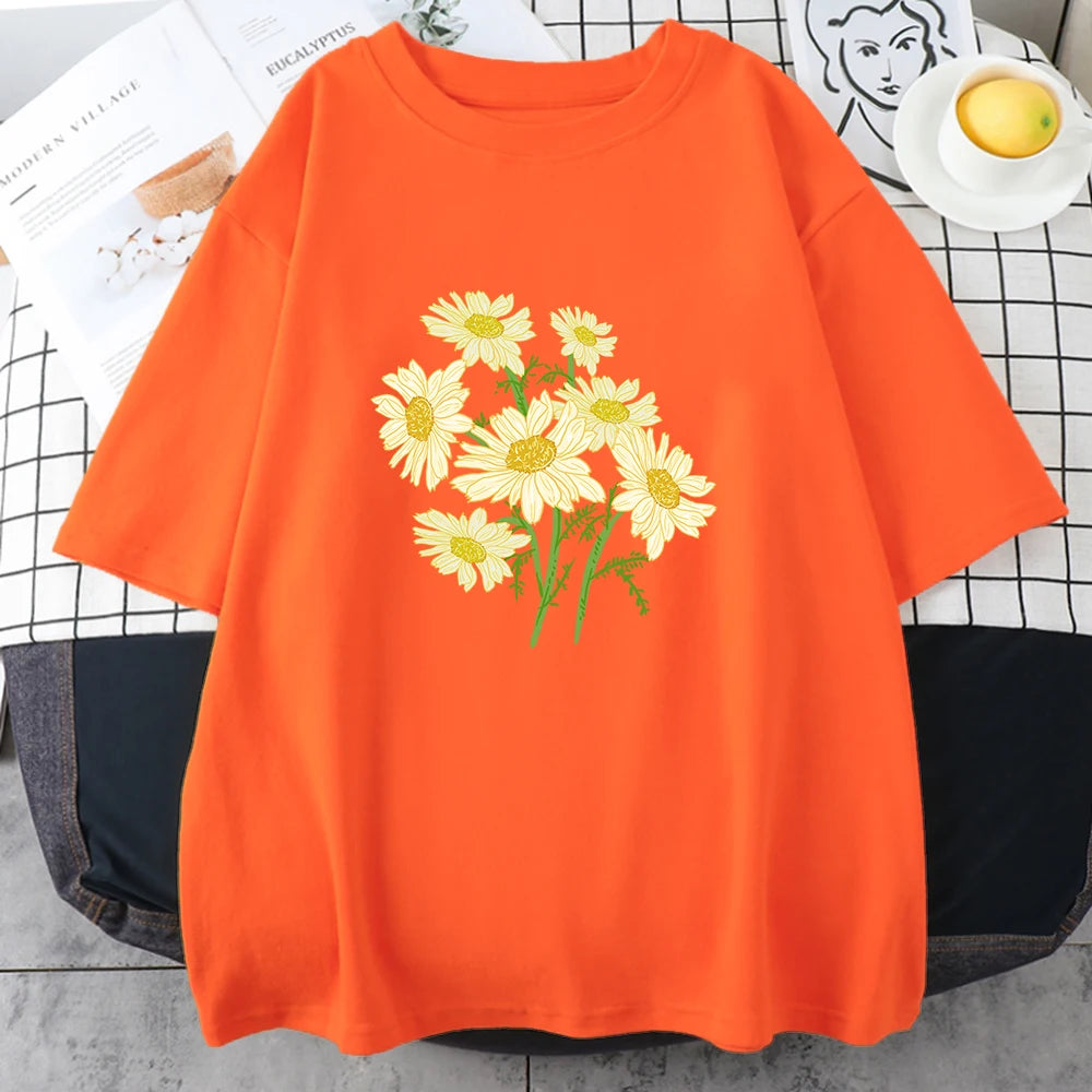 Orange short-sleeve cotton t-shirt printed with a bouquet of yellow and cream daisy-like chrysanthemums