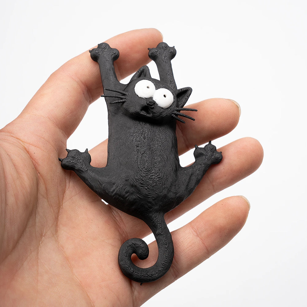 The magnet held in a hand, roughly palm-sized