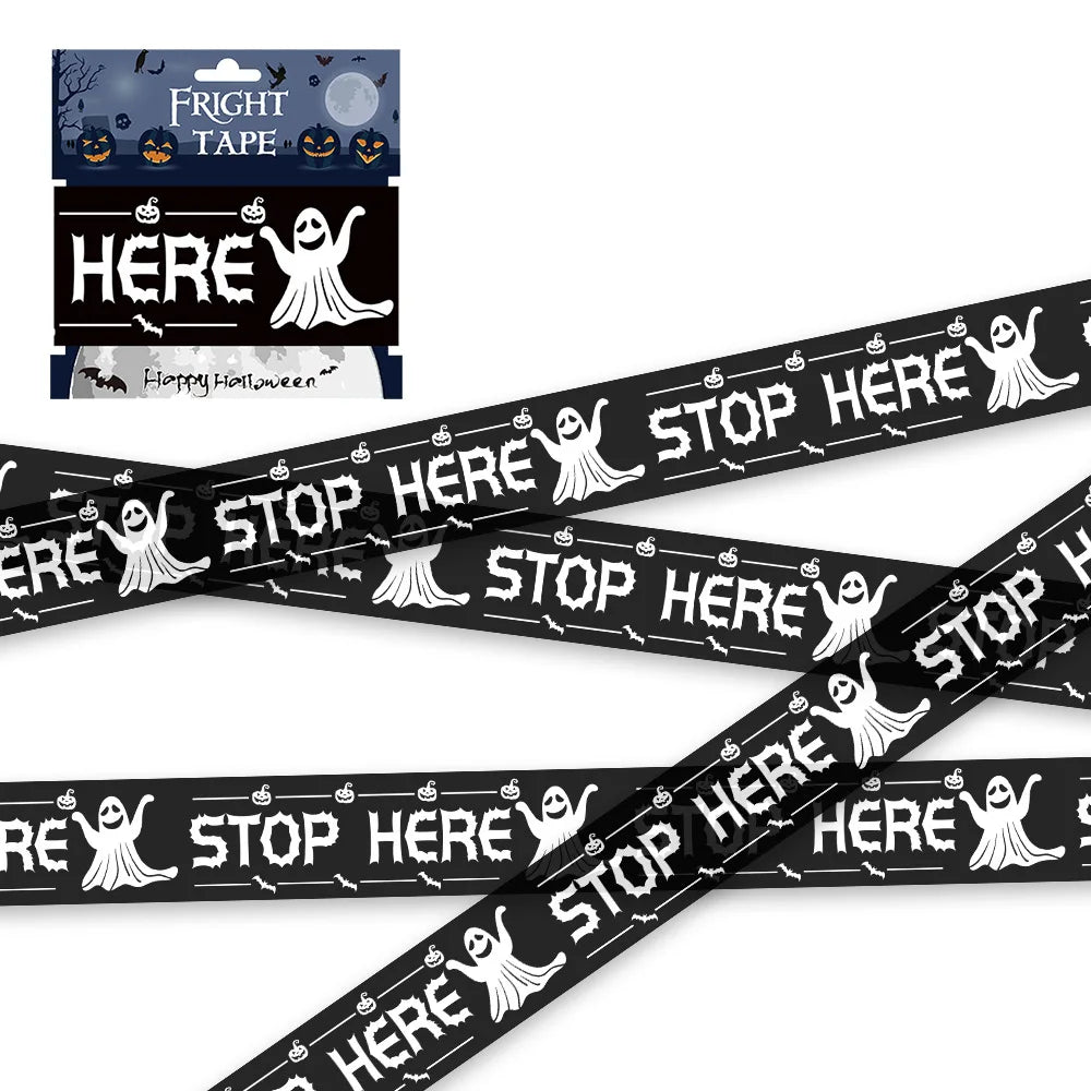 Black barrier tape printed with stop here and cartoon ghosts