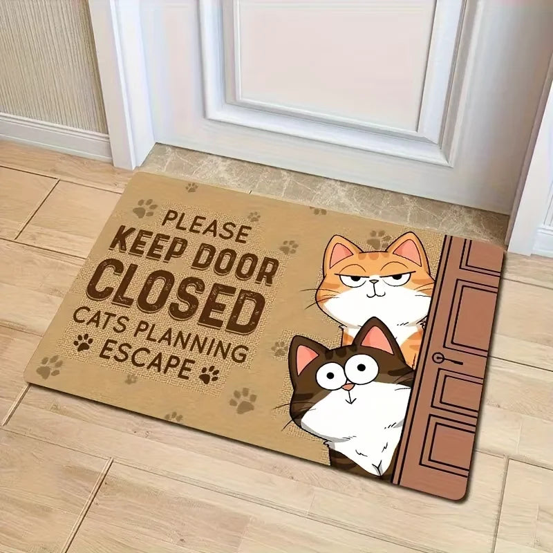 Burlap look doormat with a ginger cat above a brown and white cat leaning around a door, on tiled flooring