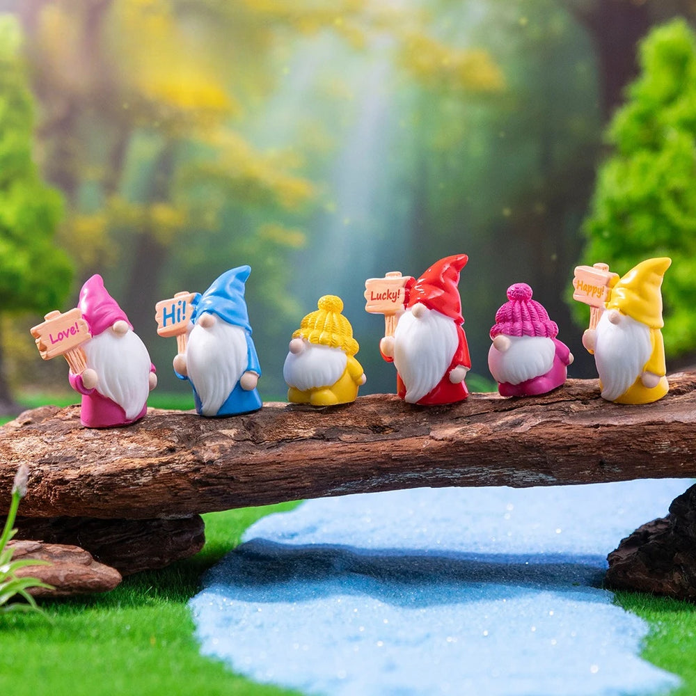 A row of the gnomes lined up along a driftwood log against a woodland backdrop - the log and backdrop are not included