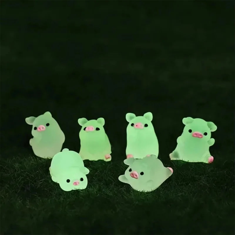 The pigs glowing green in the dark on grass