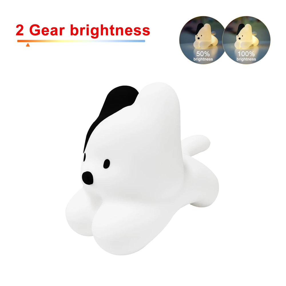 Dog-shaped light lying down with a black patch over one ear