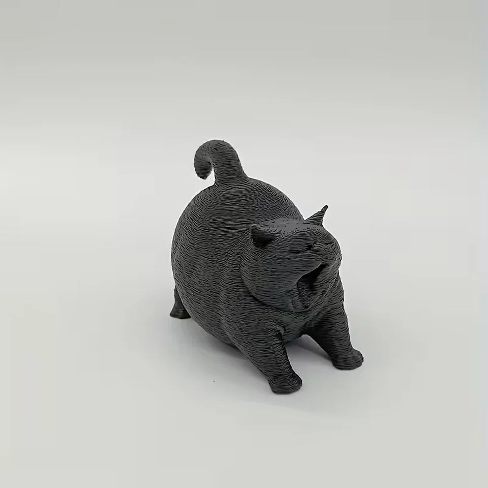 Estatua de gato bostezando como decoración de escritorio