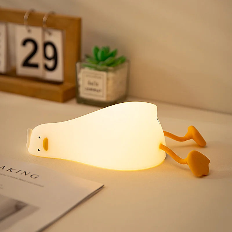 Lying flat duck lamp switched off on a desk