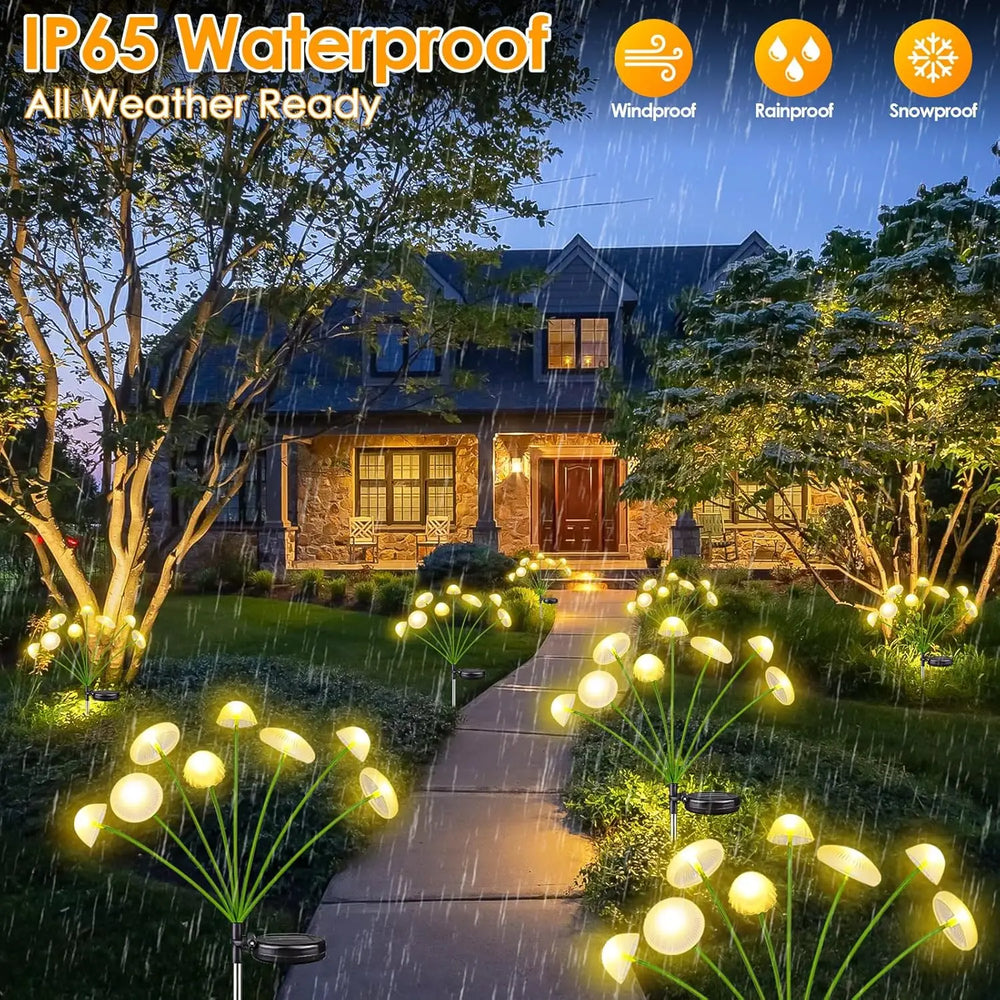 The lights running along a garden path at night in front of a lit house