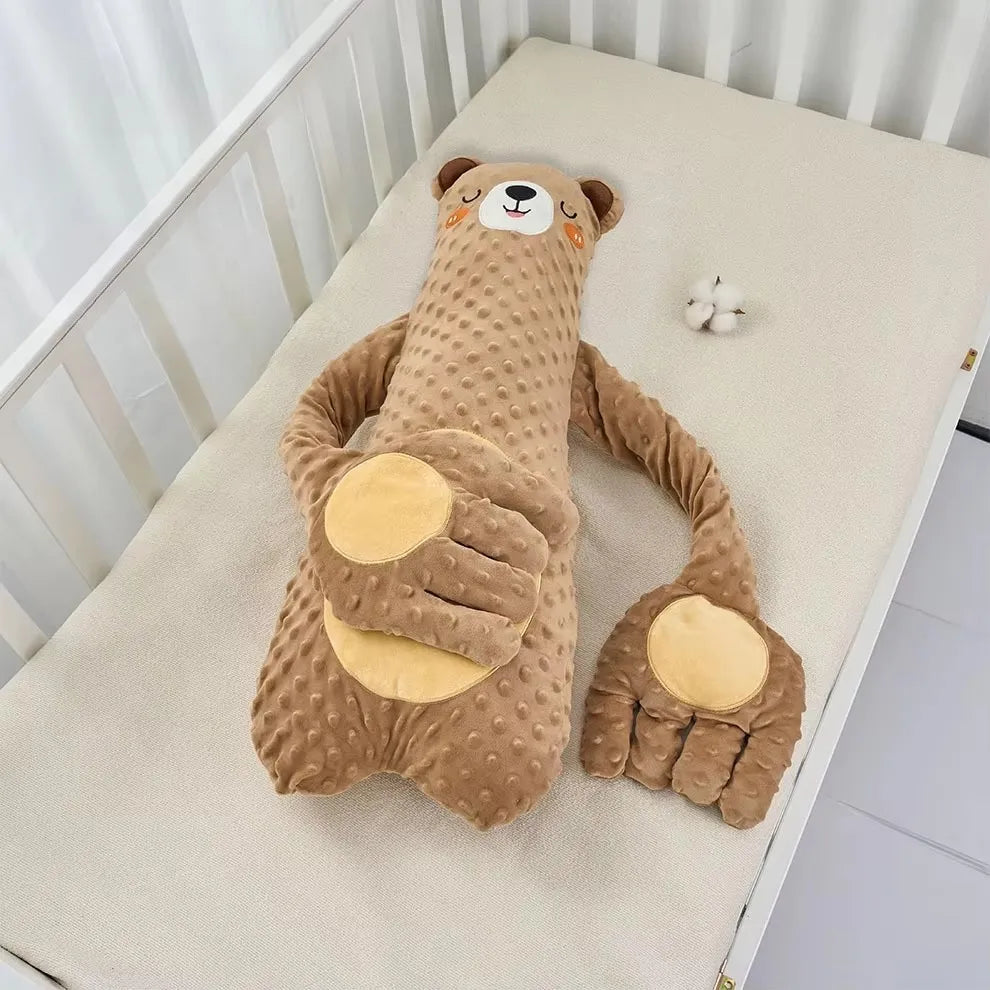 The brown bear design lying on a cot mattress, showing the long body and the two folded arms