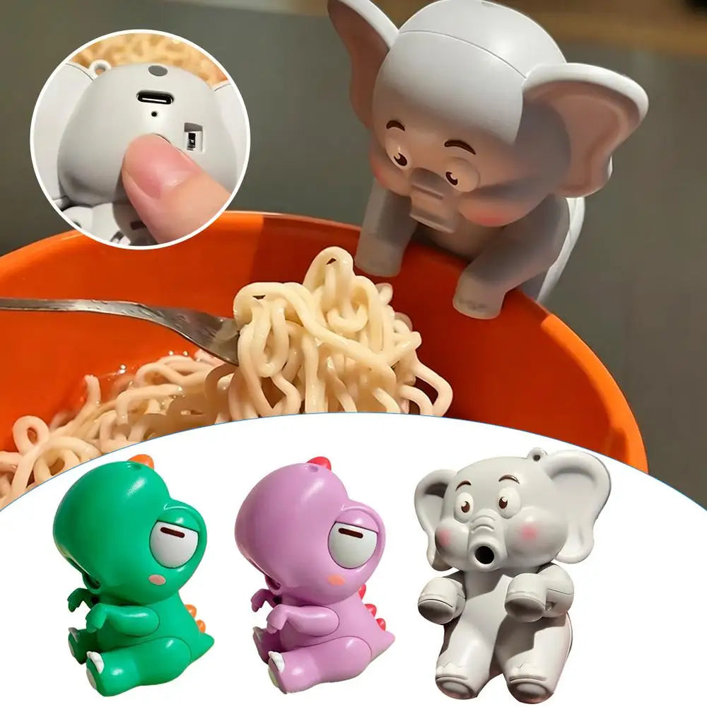 The grey elephant fan hooked over the rim of an orange noodle bowl, with an inset close-up of the USB-C charging port and switch, and the three designs shown below