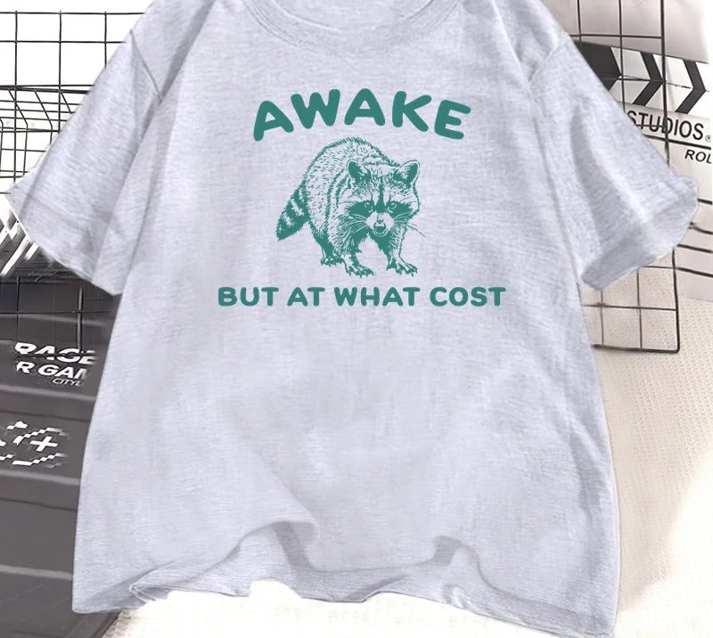 Grey marl cotton tee printed with a teal engraved raccoon and the words awake but at what cost