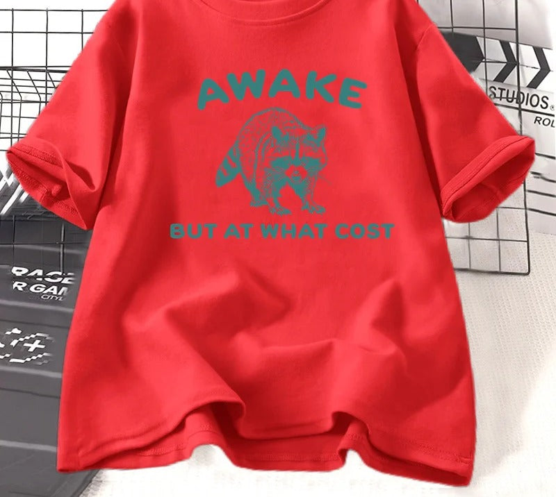 Red cotton tee printed with a teal engraved raccoon and the words awake but at what cost