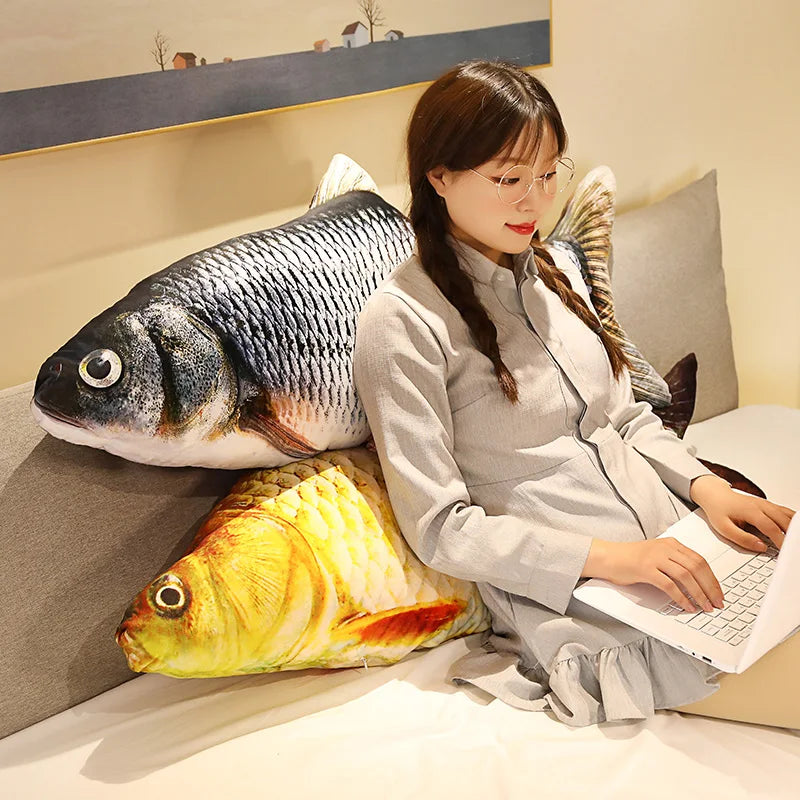 The grass carp and crucian carp propped against a headboard - the bedding and keyboard are not included