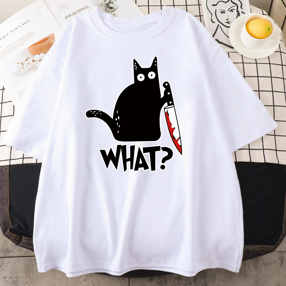 White cotton tee printed with a black cat holding a bloody knife above the word WHAT
