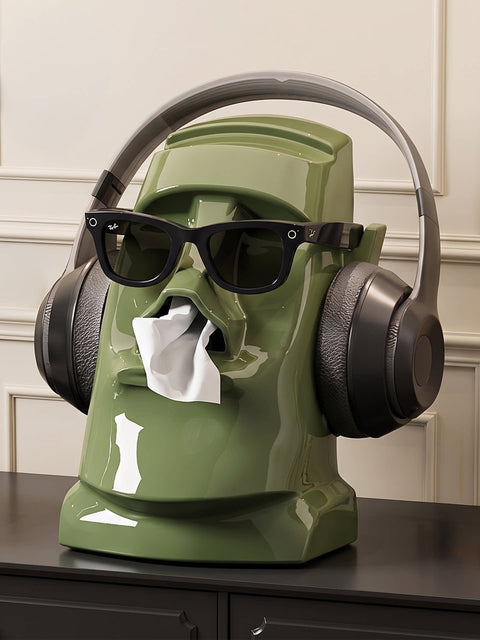 Green Sculptural Stone Tissue Box with headphones and sunglasses
