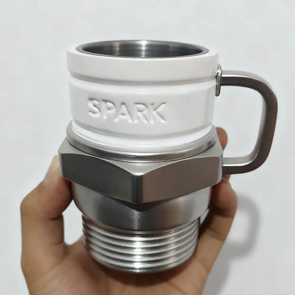 The mug held in one hand, showing it is roughly palm-sized