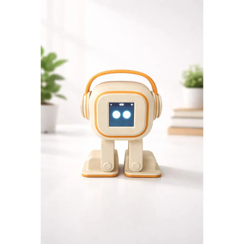 Cream and orange desk robot with headphones and two round lit eyes, standing on a white surface