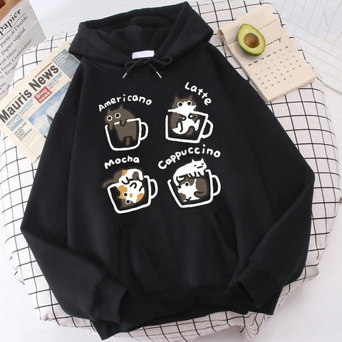 Black fleece-lined pullover hoodie printed with four cartoon cats sitting in outlined coffee mugs labelled Americano, Latte, Mocha and Cappuccino
