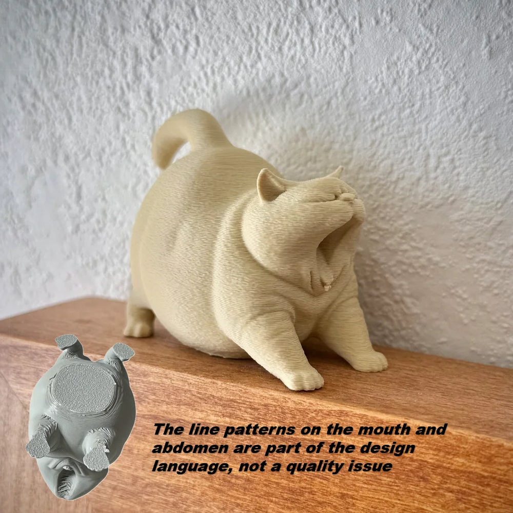 Estatua de gato bostezando como decoración de escritorio
