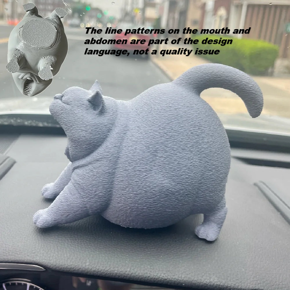 Estatua de gato bostezando como decoración de escritorio