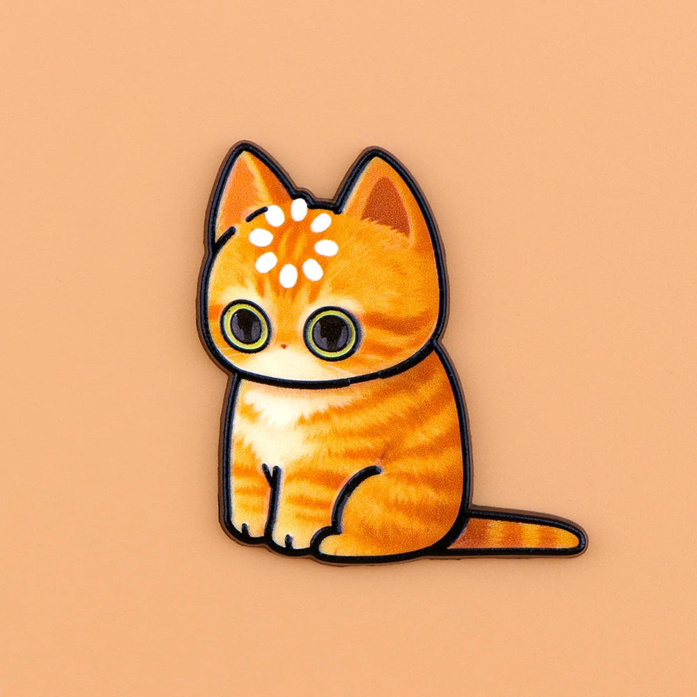 Ginger tabby cat magnet with a ring of dots on its head