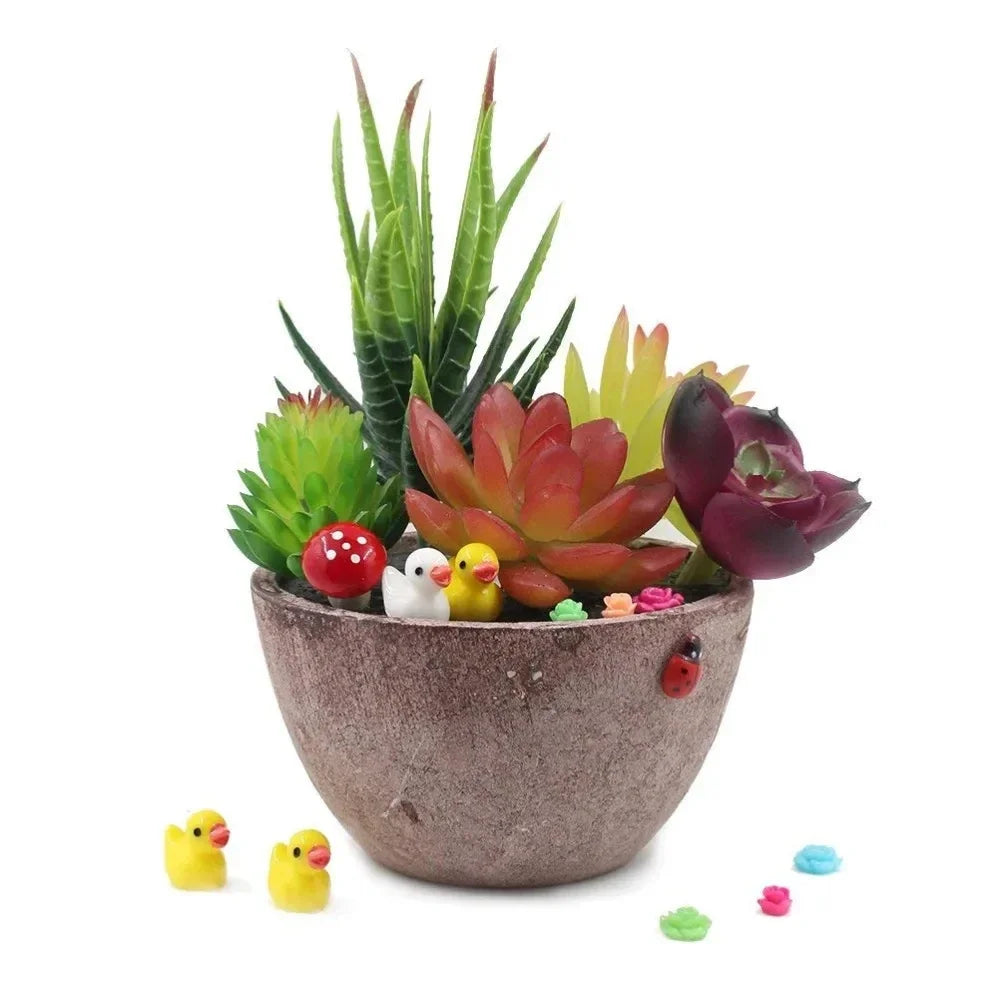 Two ducks beside a planted succulent bowl - the plant and pot are not included