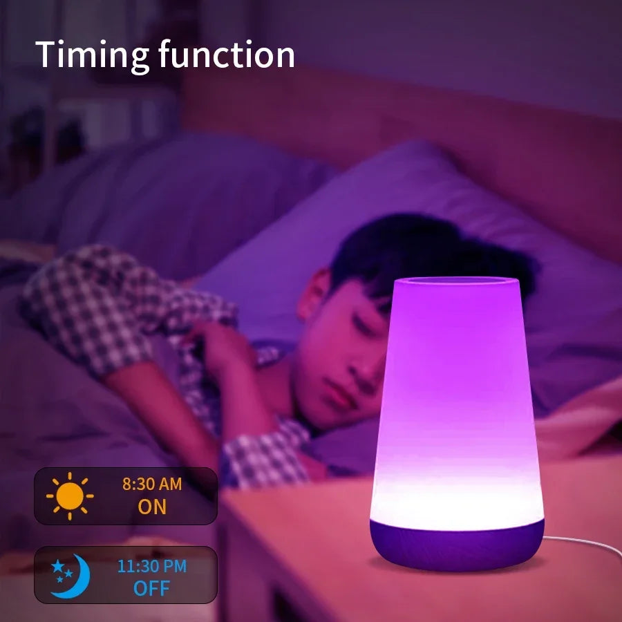 The lamp glowing purple on a bedside table next to a sleeping child, with an on and off schedule shown