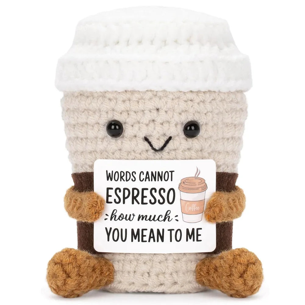 Crochet positive affirmation doll holding an encouragement card