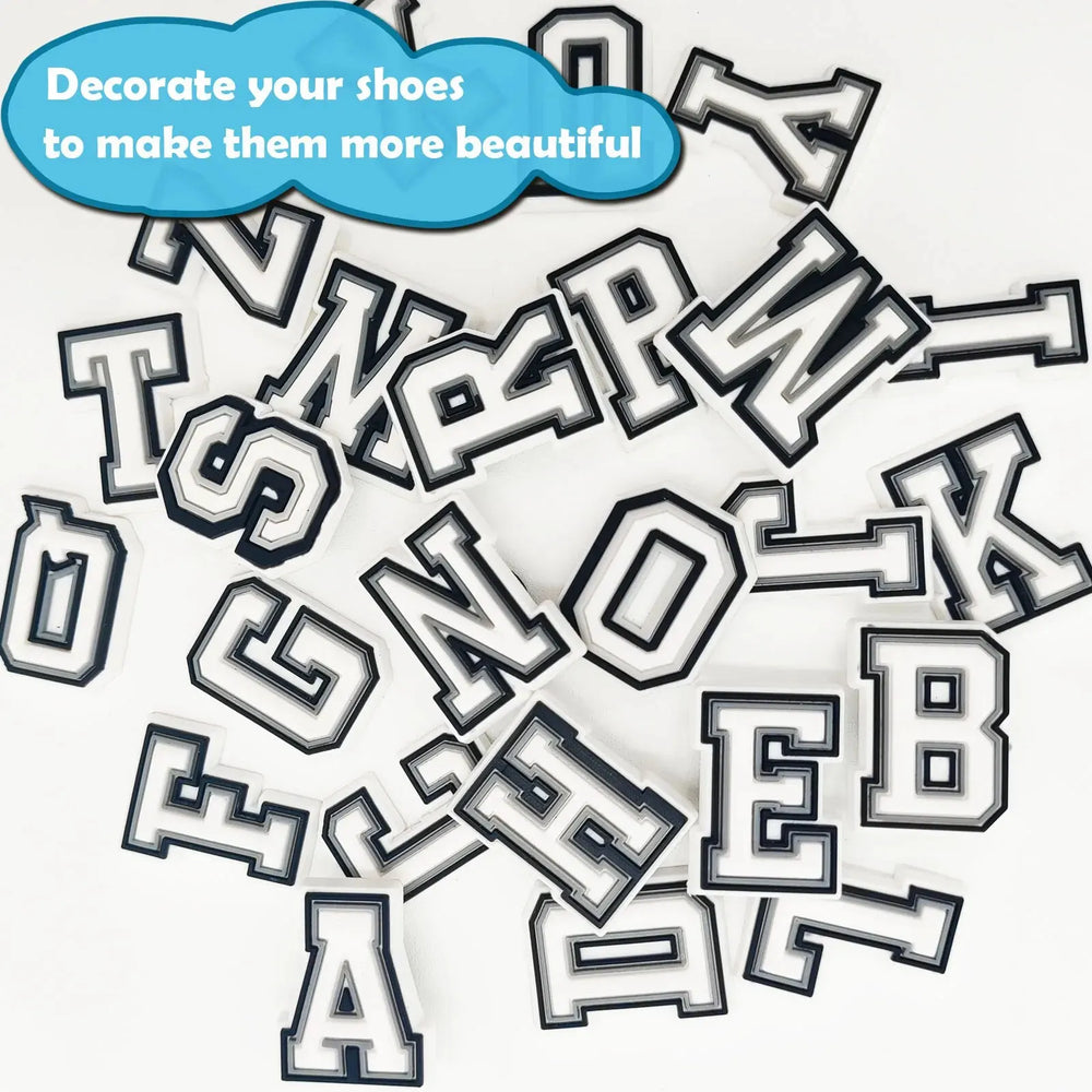 The 26 letter charms scattered in a pile