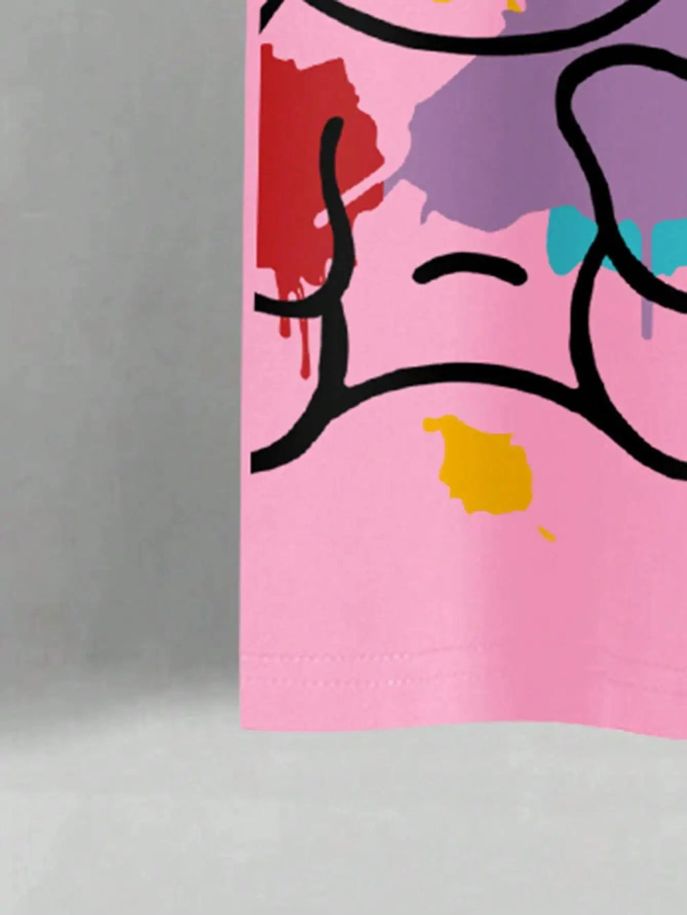 Close view of the printed bear head in black outline over yellow, purple and turquoise paint