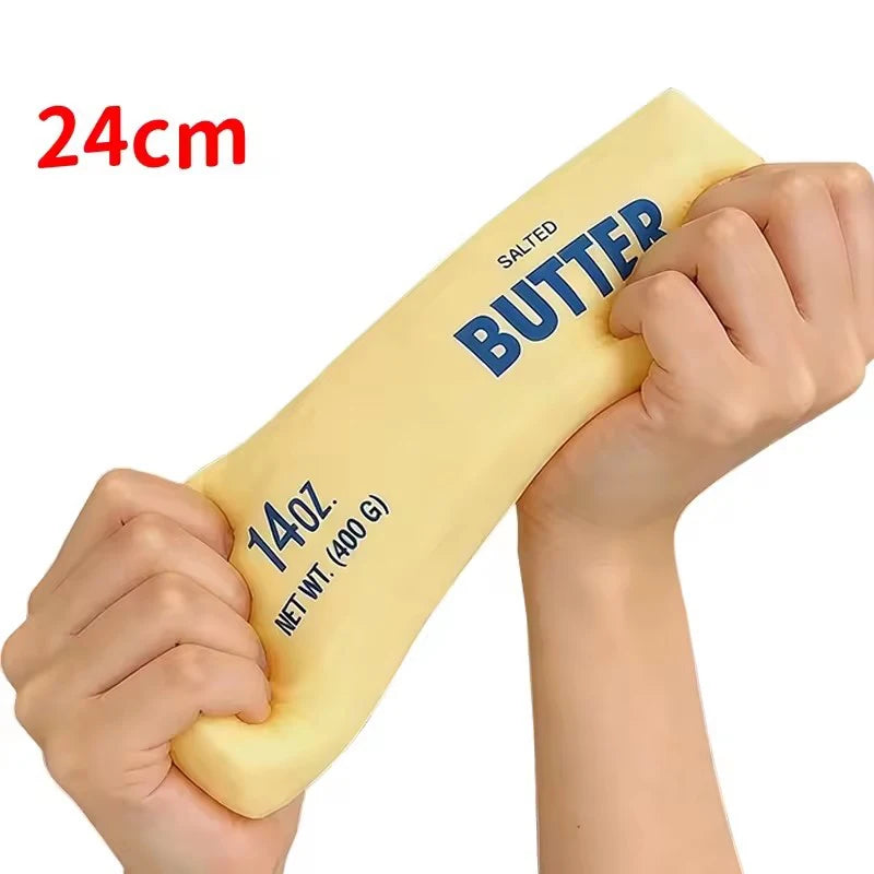 Giant Butter 24cm stretched between two hands, printed NET WT. 400 G