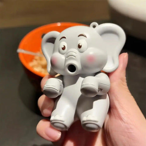 The grey elephant fan held in a hand above a bowl, the only indication of its size on the listing
