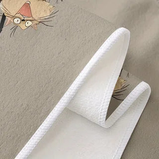 Close-up of the towel hem, showing the printed grey face and the plain textured white reverse