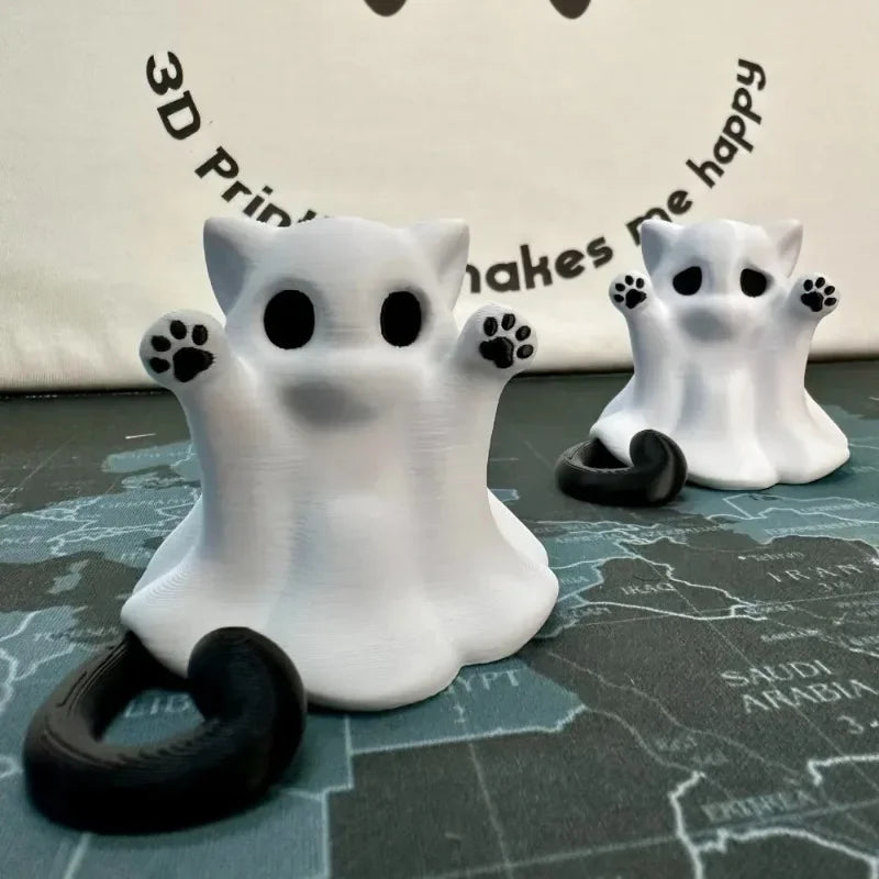 Two ghost cats, a larger and a smaller, standing on a map desk mat